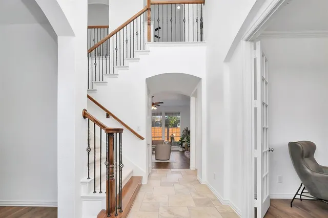 a view of entryway and hall with wooden floor