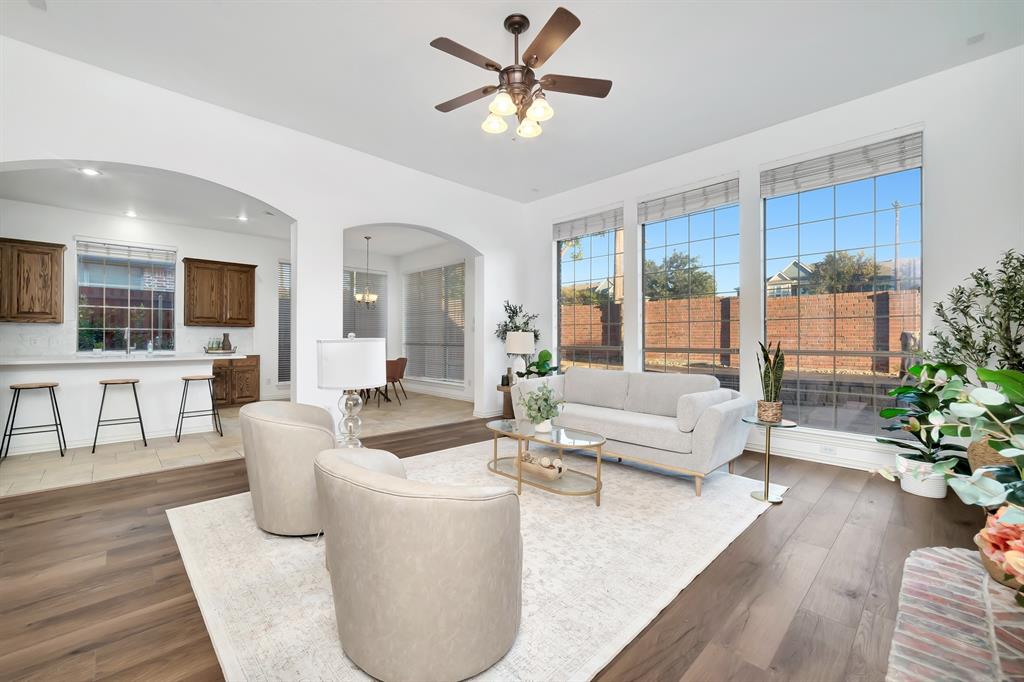 9328 Old Veranda Road Plano, TX 75024 - Photo 6 of 40 a living room with furniture and a large window with wooden floor