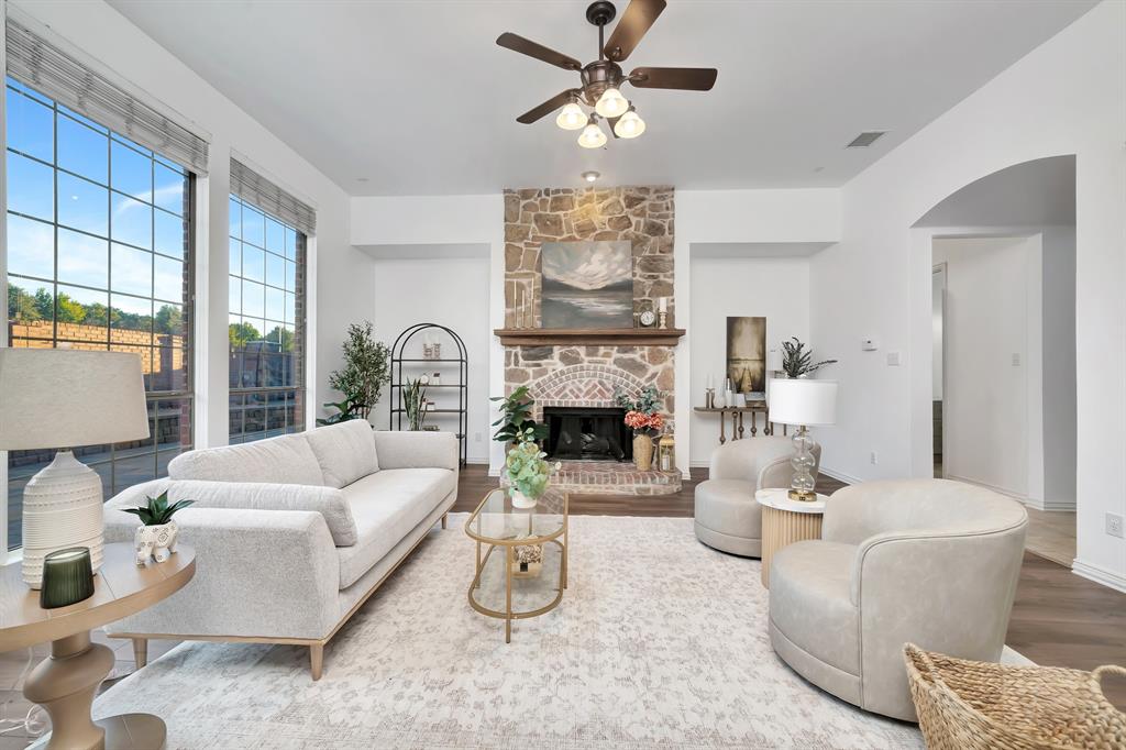 9328 Old Veranda Road Plano, TX 75024 - Photo 8 of 40 a living room with furniture a fireplace and a large window