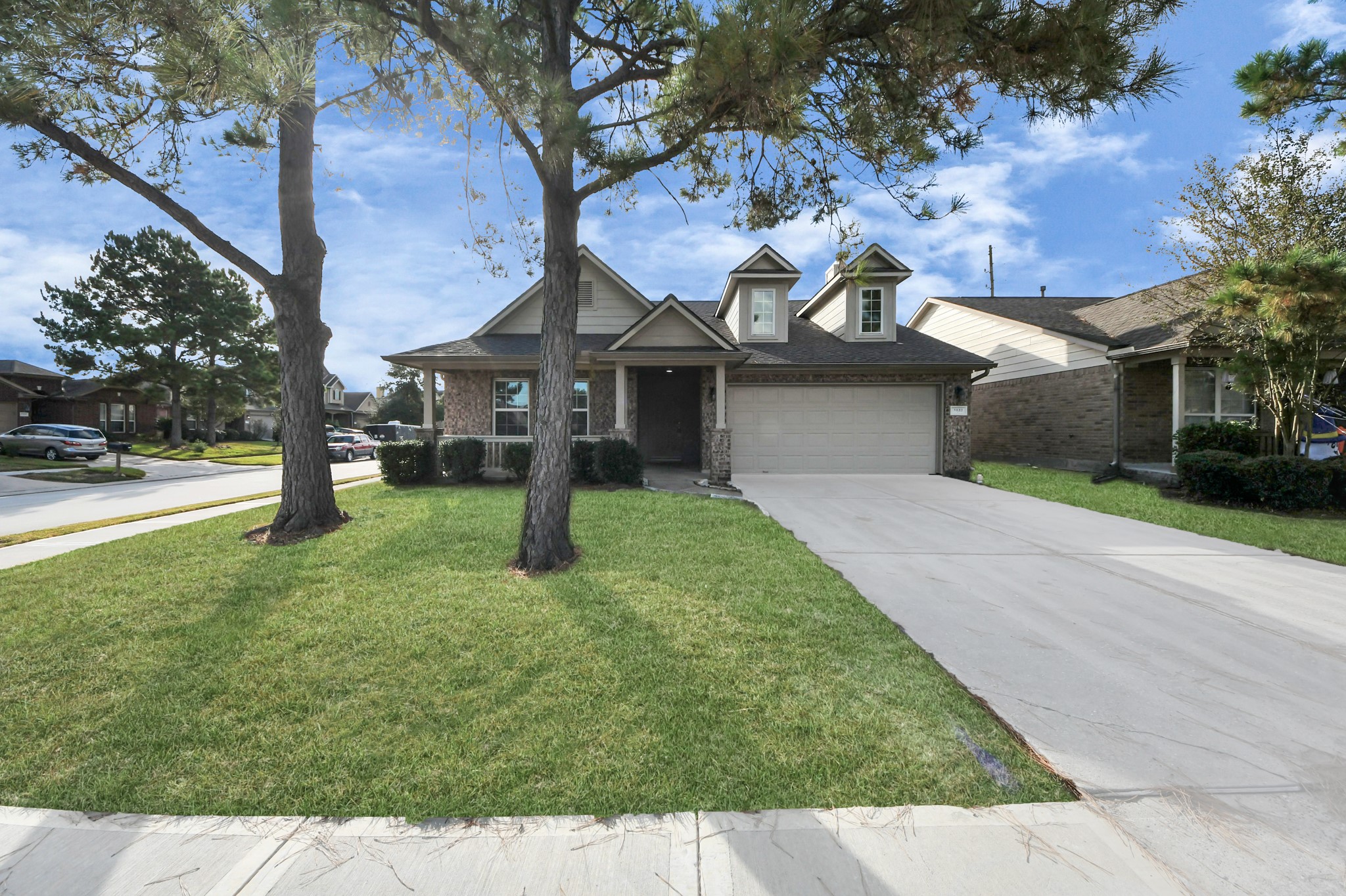 3122 Pathfinders Pass Spring, TX 77373 - Photo 21 of 23 a front view of a house with a yard and garage