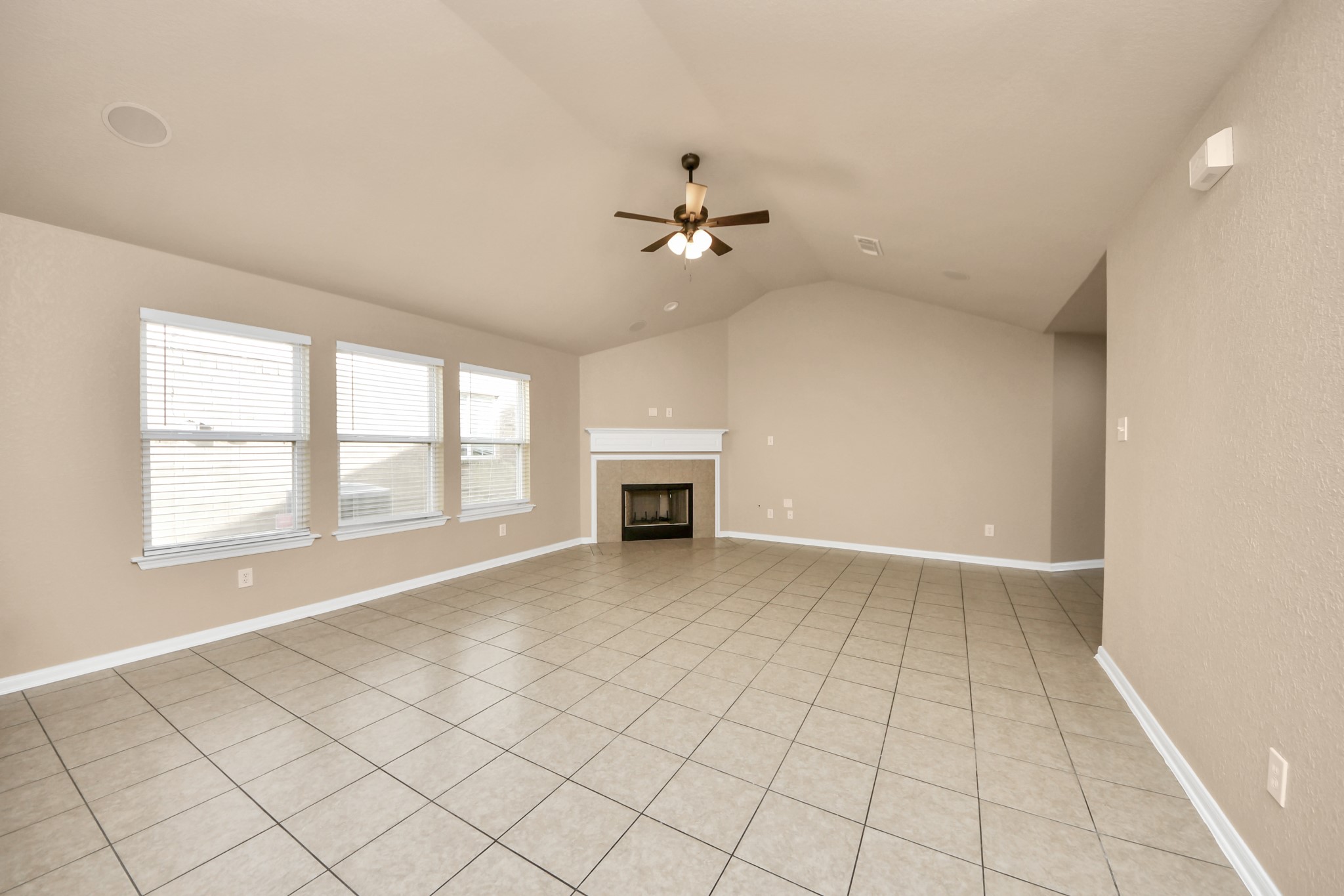 3122 Pathfinders Pass Spring, TX 77373 - Photo 3 of 23 an empty room with windows and fireplace