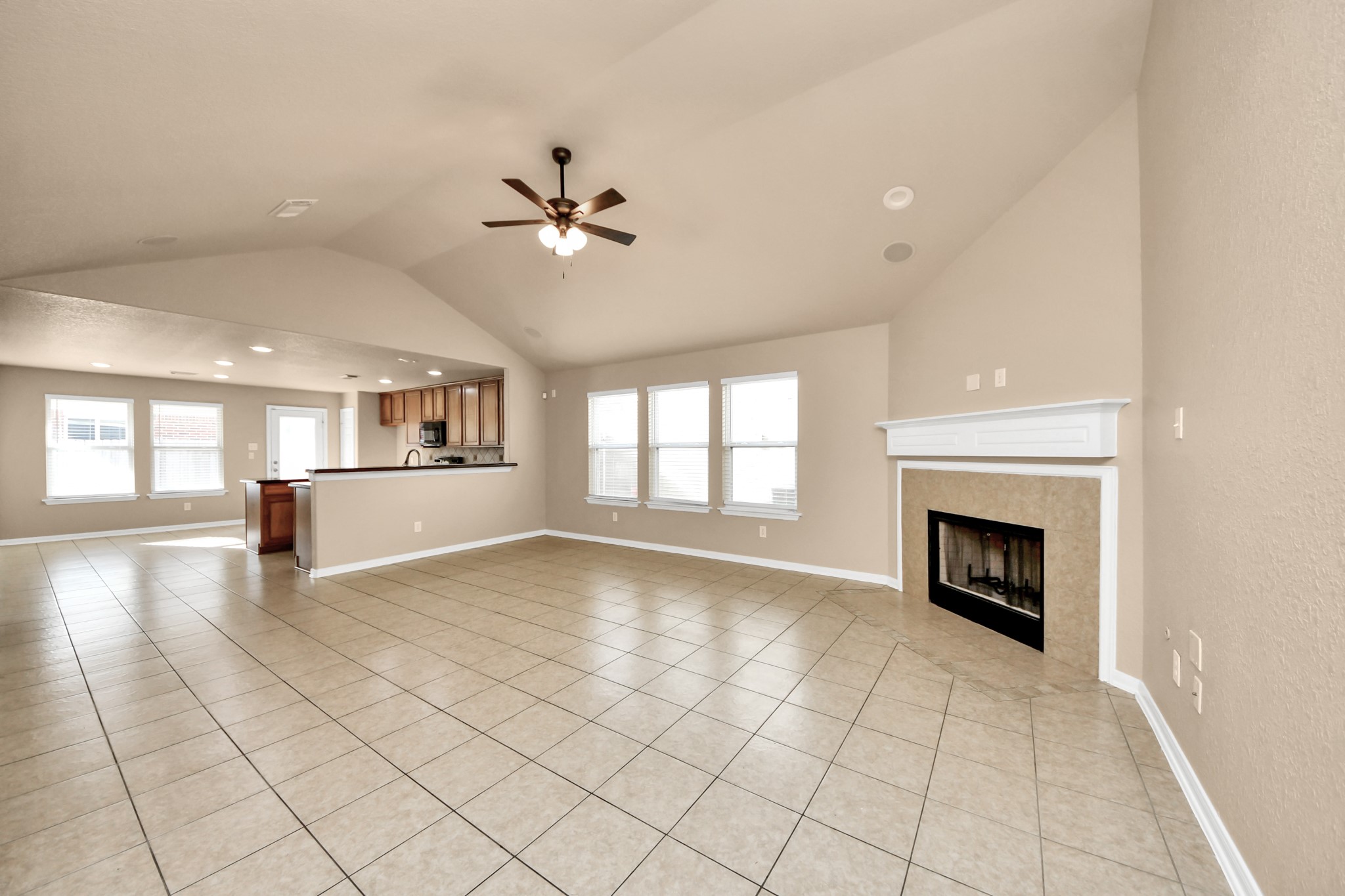 3122 Pathfinders Pass Spring, TX 77373 - Photo 4 of 23 a view of empty room with fireplace and windows