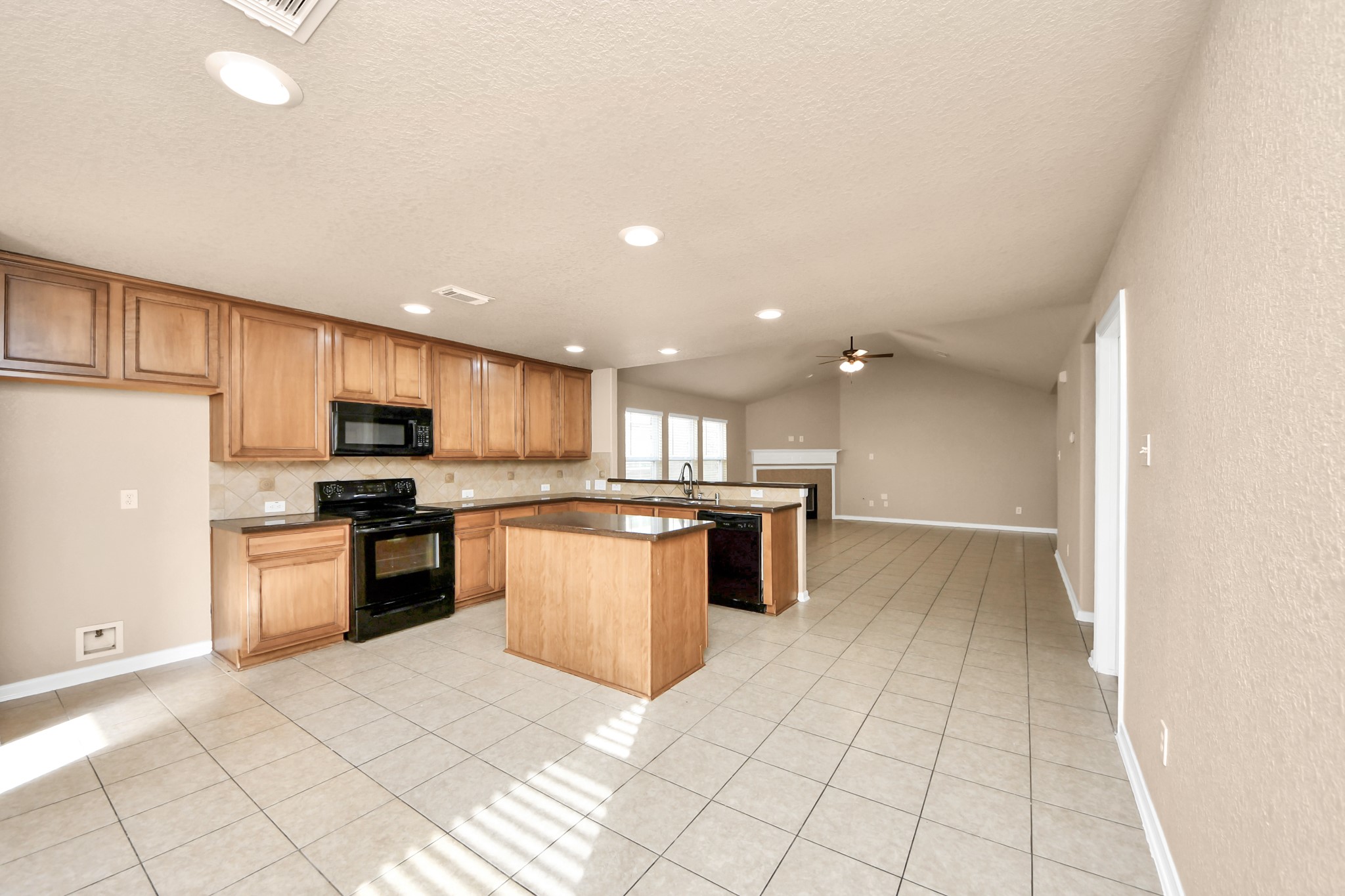 3122 Pathfinders Pass Spring, TX 77373 - Photo 7 of 23 a large kitchen with a large counter top stainless steel appliances and cabinets