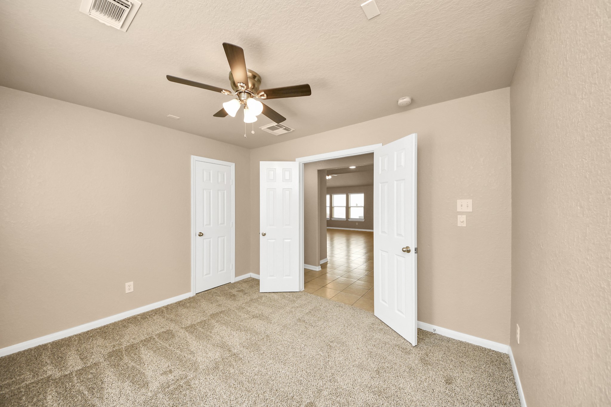 3122 Pathfinders Pass Spring, TX 77373 - Photo 10 of 23 a view of an empty room and a ceiling fan