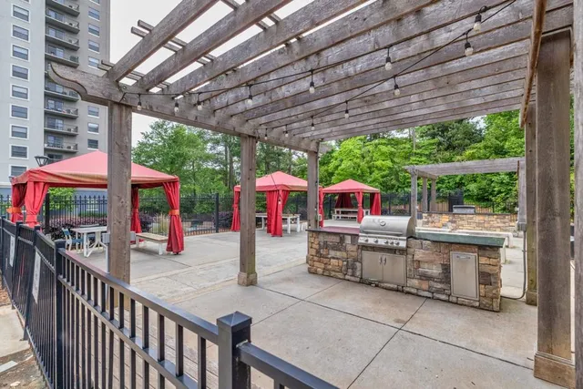 a view of roof deck with sitting area