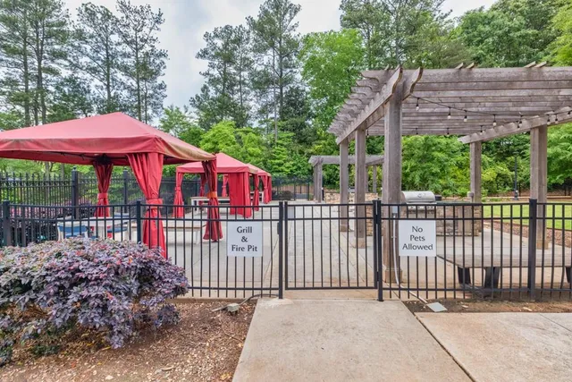 a view of a wrought iron fences in front of a yard