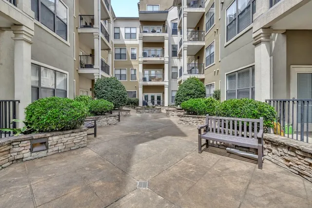 a view of a building with a bench in front of a building