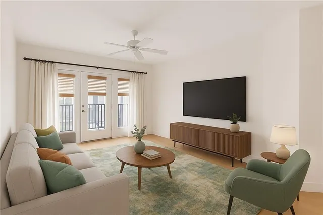 a living room with furniture and a flat screen tv