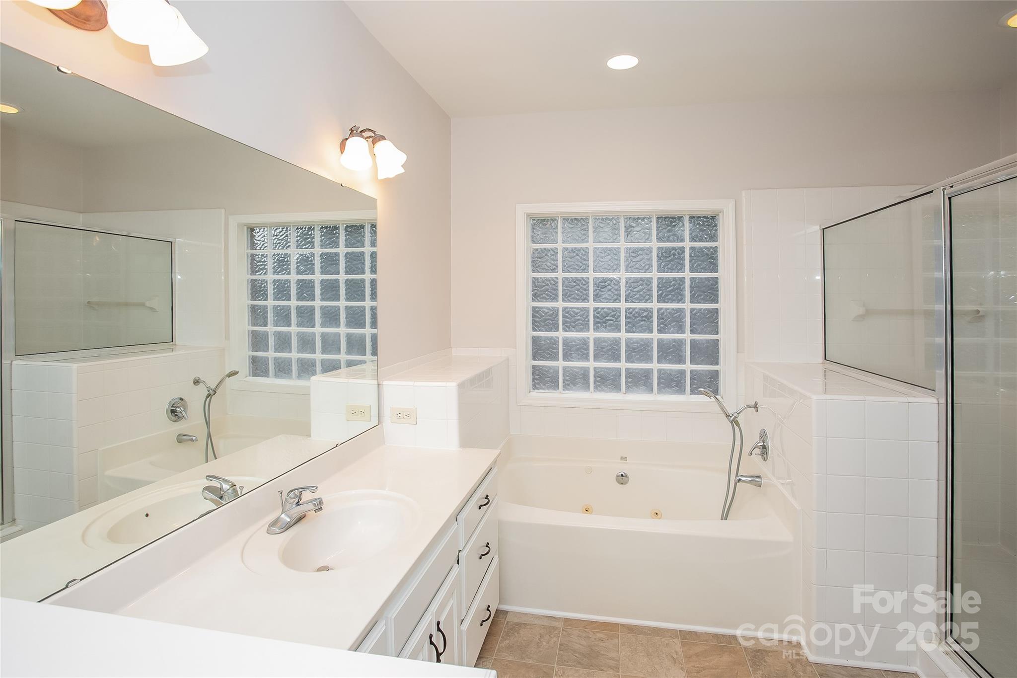 841 Old Farm Road Oakboro, NC 28129 - Photo 12 of 20 a bathroom with a bathtub and a sink