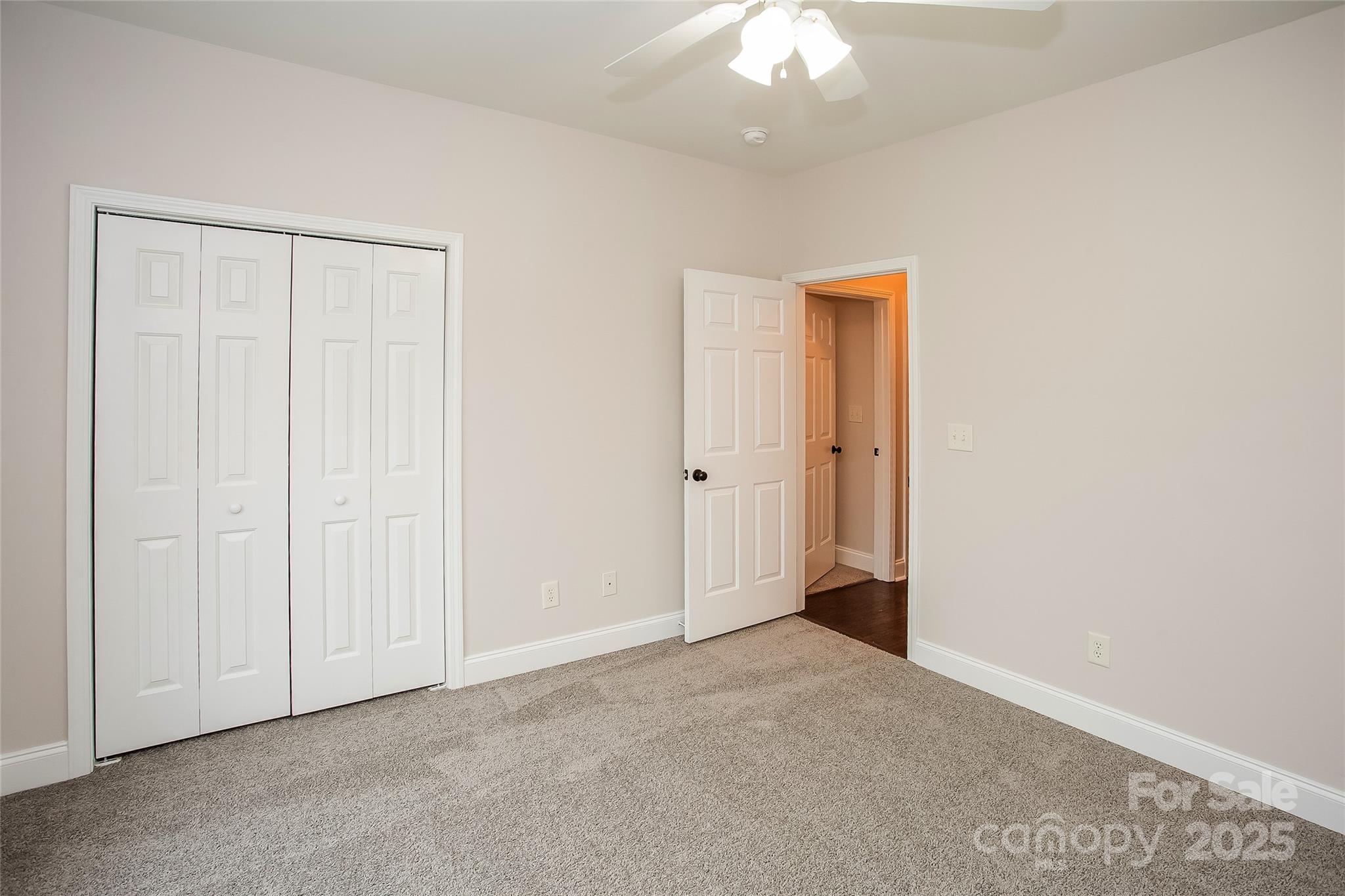 841 Old Farm Road Oakboro, NC 28129 - Photo 14 of 20 an empty room with a ceiling fan