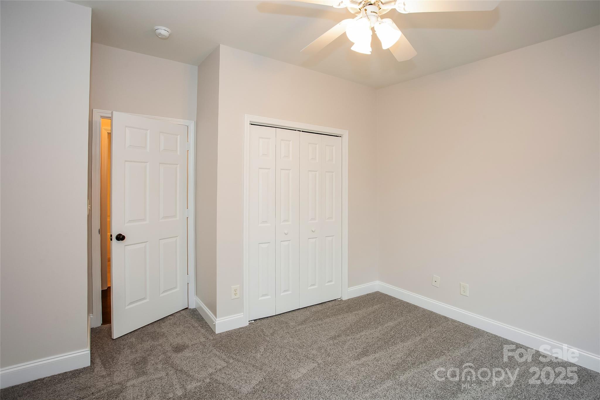 841 Old Farm Road Oakboro, NC 28129 - Photo 17 of 20 an empty room with a ceiling fan and wooden floor