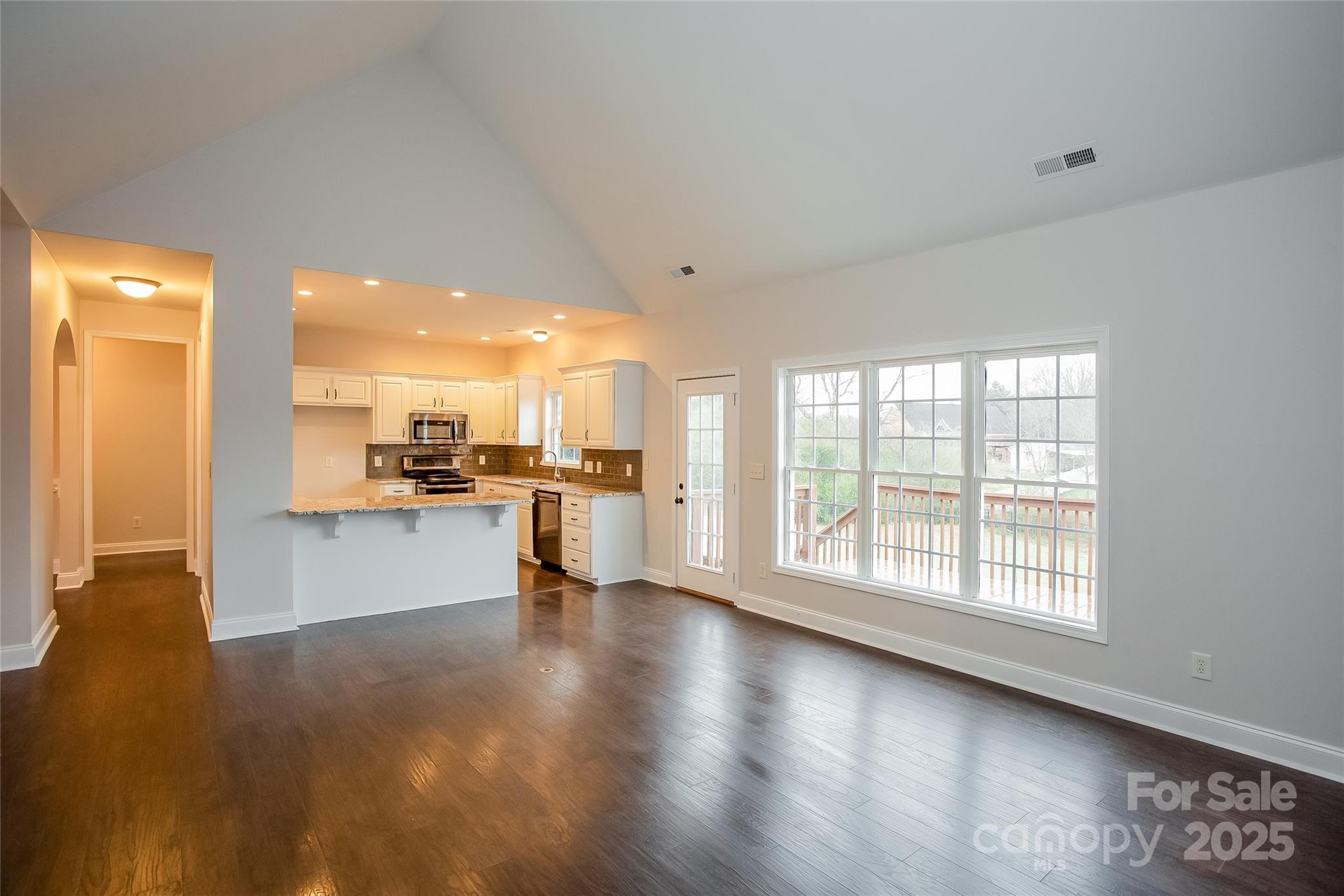 841 Old Farm Road Oakboro, NC 28129 - Photo 6 of 20 a view of a kitchen with a sink and a large window