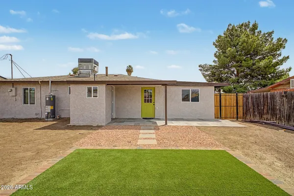 a view of a house with a yard and garage
