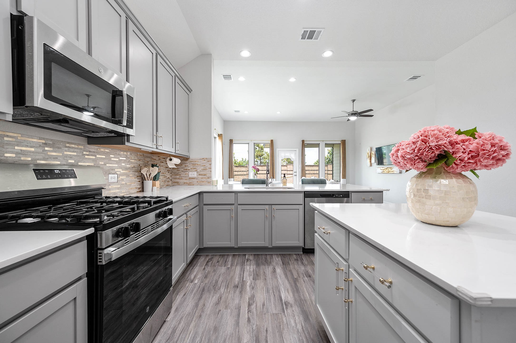10926 Wander Way Beasley, TX 77417 - Photo 7 of 38 a kitchen with a sink stove top oven and microwave