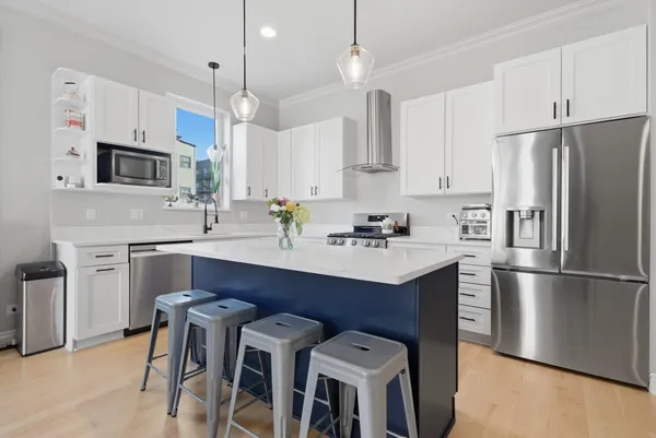 a kitchen with refrigerator cabinets and white appliances