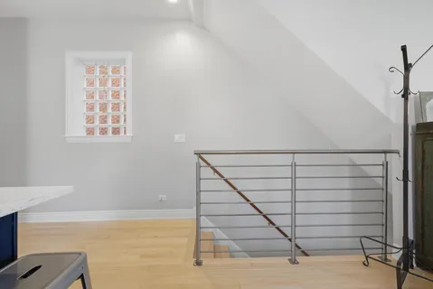 a view of room with window and a ceiling fan