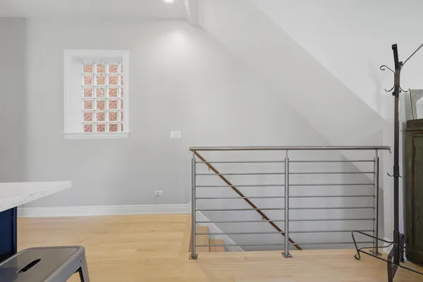 a view of room with window and a ceiling fan