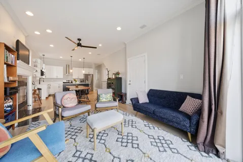 a living room with furniture and a rug