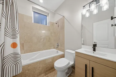 a bathroom with a sink a toilet and a bathtub