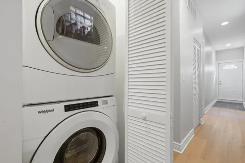 a view of a hallway with washer and dryer