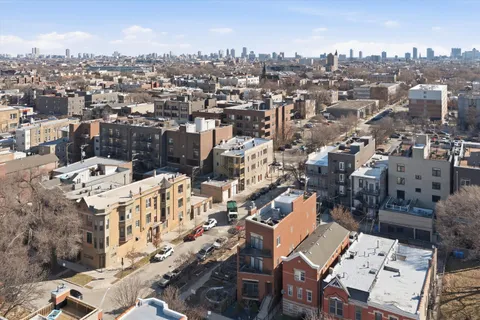 an aerial view of a city with lots of residential buildings