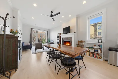 a view of a livingroom with furniture and a kitchen