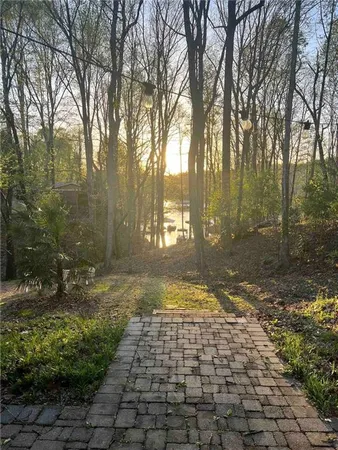a view of a pathway with a yard