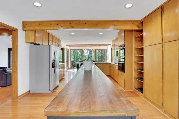 a view of a kitchen with a refrigerator