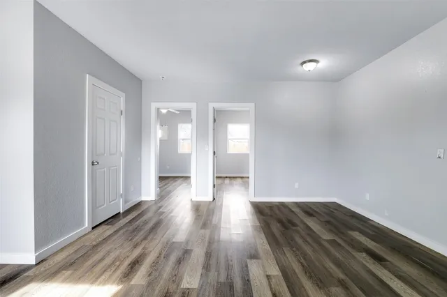 a view of wooden floor in an empty room