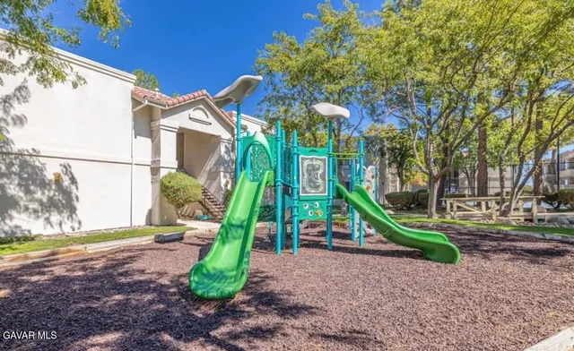 a view of a dining room with furniture and a floor to ceiling window