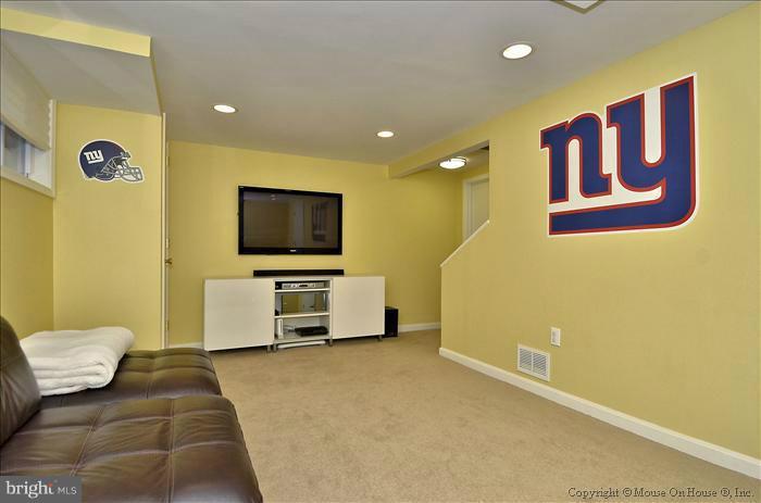 5512 Northfield Road Bethesda, MD 20817 - Photo 15 of 29 a living room with furniture and a flat screen tv