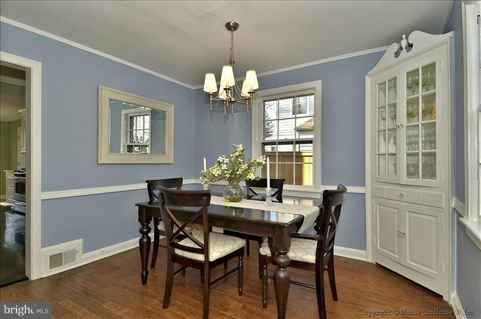 5512 Northfield Road Bethesda, MD 20817 - Photo 22 of 29 a dining room with furniture a chandelier and wooden floor