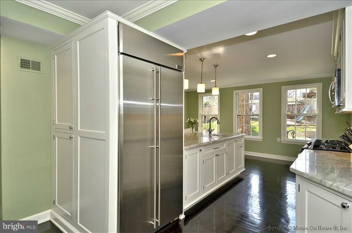 5512 Northfield Road Bethesda, MD 20817 - Photo 28 of 29 a bathroom with a double vanity sink a toilet and a shower