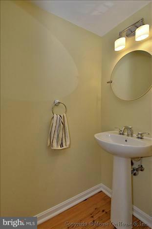 5512 Northfield Road Bethesda, MD 20817 - Photo 4 of 29 a bathroom with a sink and mirror