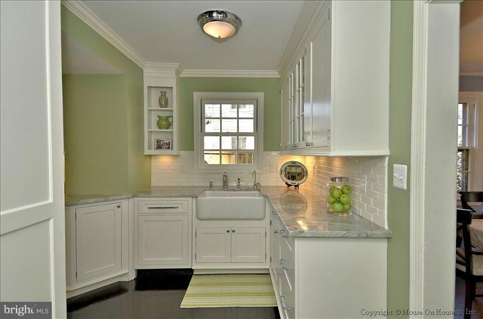 5512 Northfield Road Bethesda, MD 20817 - Photo 10 of 29 a bathroom with a sink and a mirror