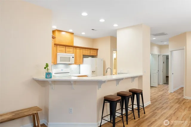 a kitchen with stainless steel appliances a sink and cabinets