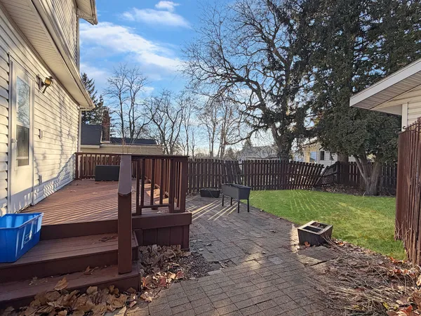 a view of a bench in the backyard