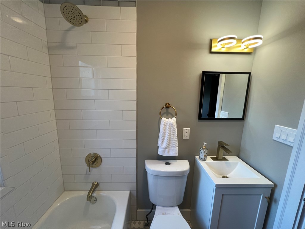 4523 Maplecrest Avenue Parma, OH 44134 - Photo 17 of 31 Full bathroom with tiled shower / bath, oversized vanity, and toilet