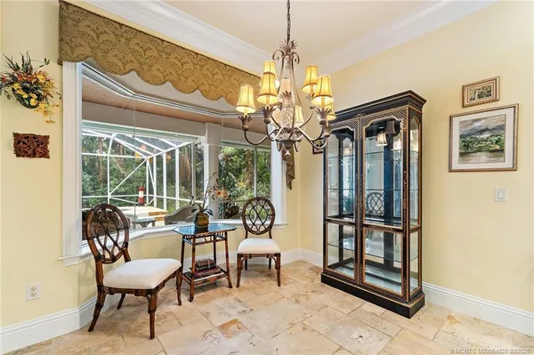 a view of a livingroom with workspace and a window