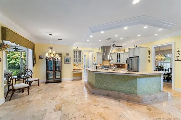 a view of a workspace with furniture window and wooden floor