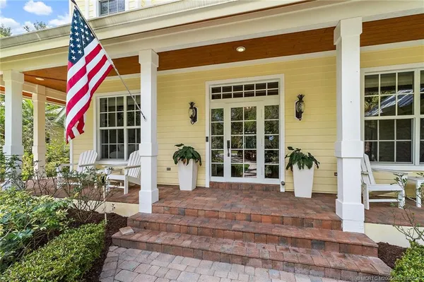 a very nice looking room with a large window and furniture