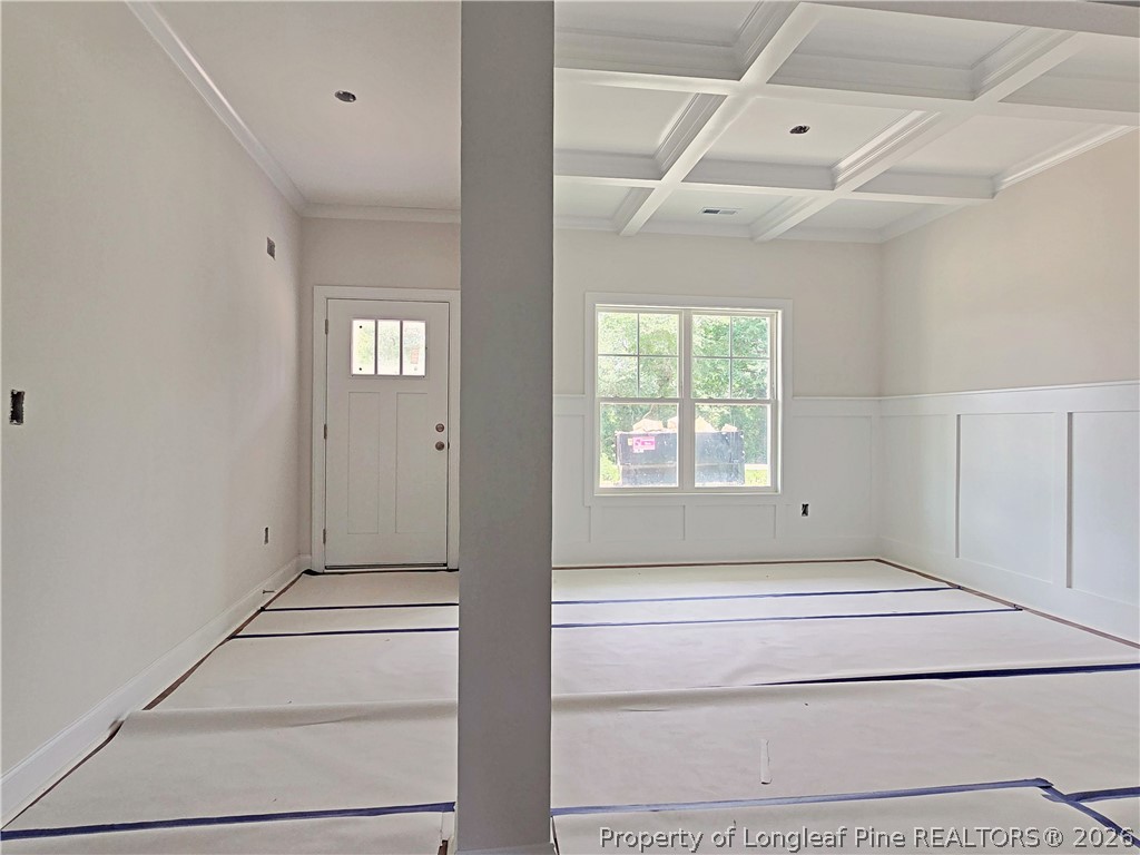 2678 Norrington Road Lillington, NC 27546 - Photo 3 of 31 a view of an empty room with wooden floor and a window