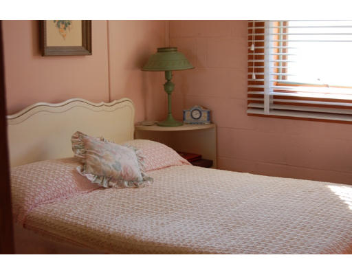 32 Appomattox Road Ipswich, MA 01938 - Photo 7 of 8 a bedroom with a bed and a window