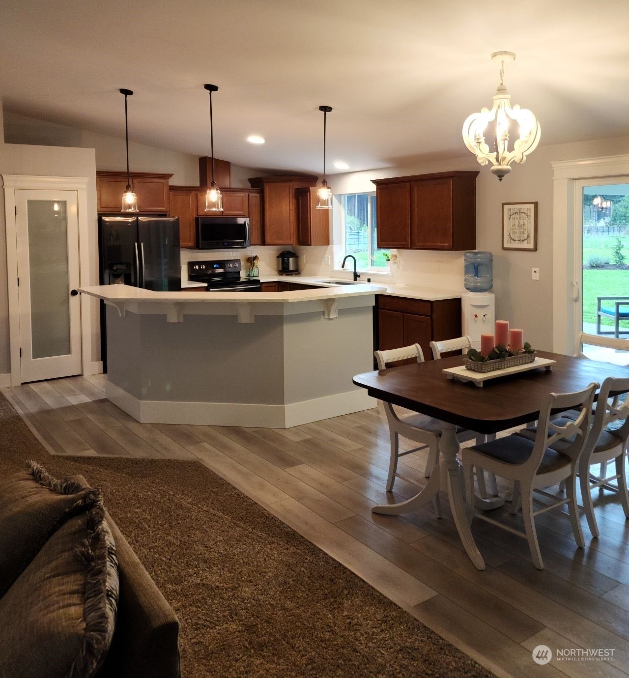 19312 Patterson Road East Orting, WA 98360 - Photo 11 of 39 a kitchen with a table and chairs in it