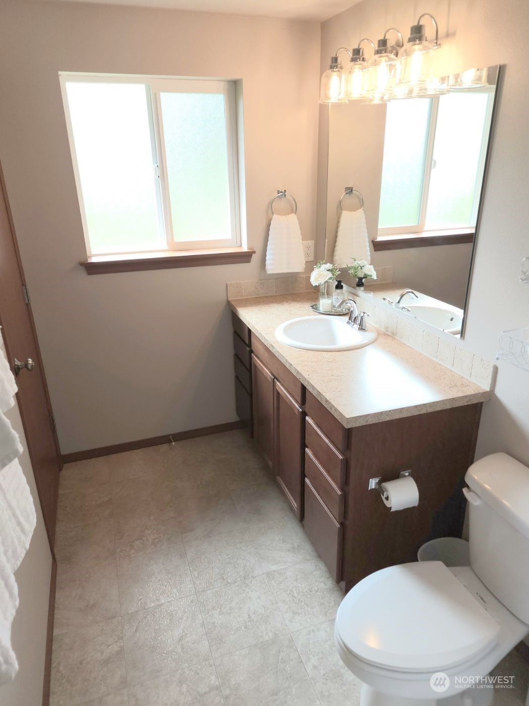 19312 Patterson Road East Orting, WA 98360 - Photo 23 of 39 a bathroom with a sink a mirror and a toilet