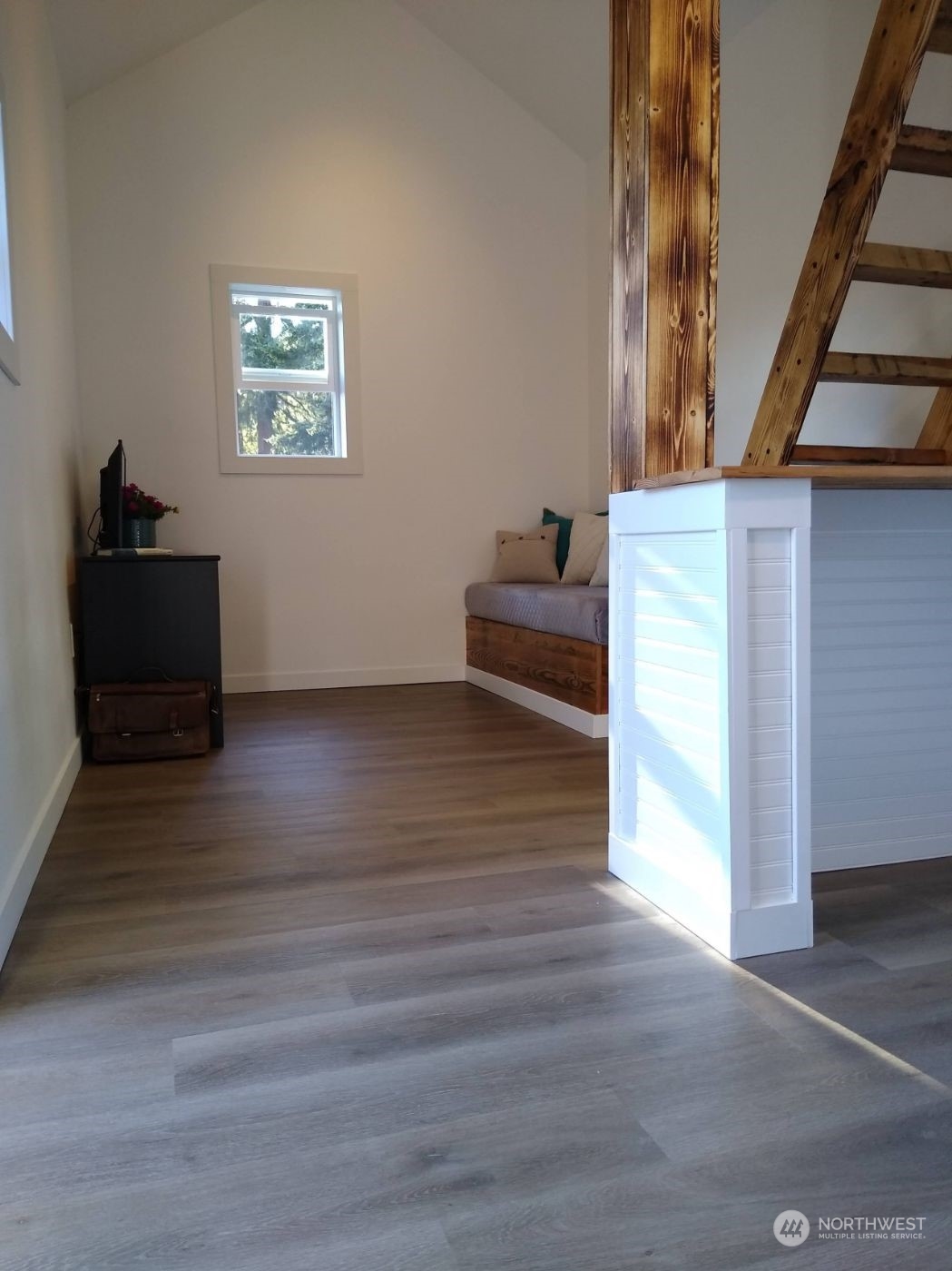 19312 Patterson Road East Orting, WA 98360 - Photo 25 of 39 a view of a livingroom with wooden floor and stairs