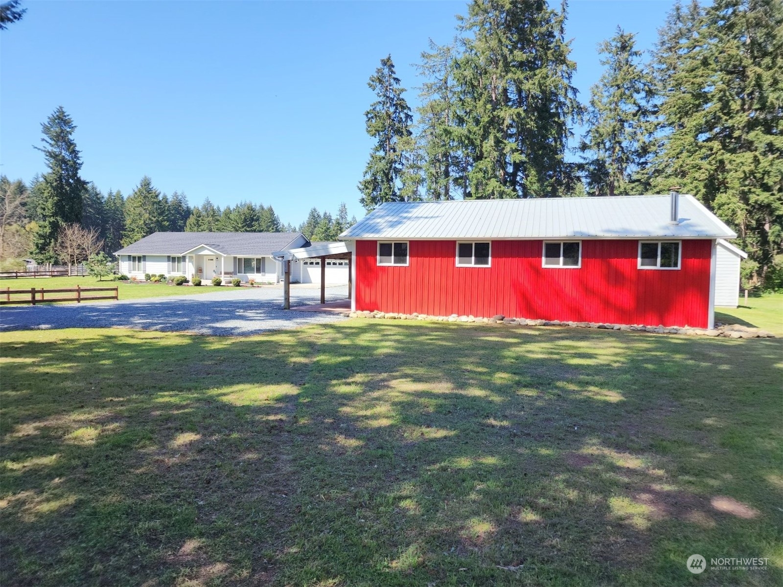 19312 Patterson Road East Orting, WA 98360 - Photo 32 of 39 a view of swimming pool with lawn chairs and large trees