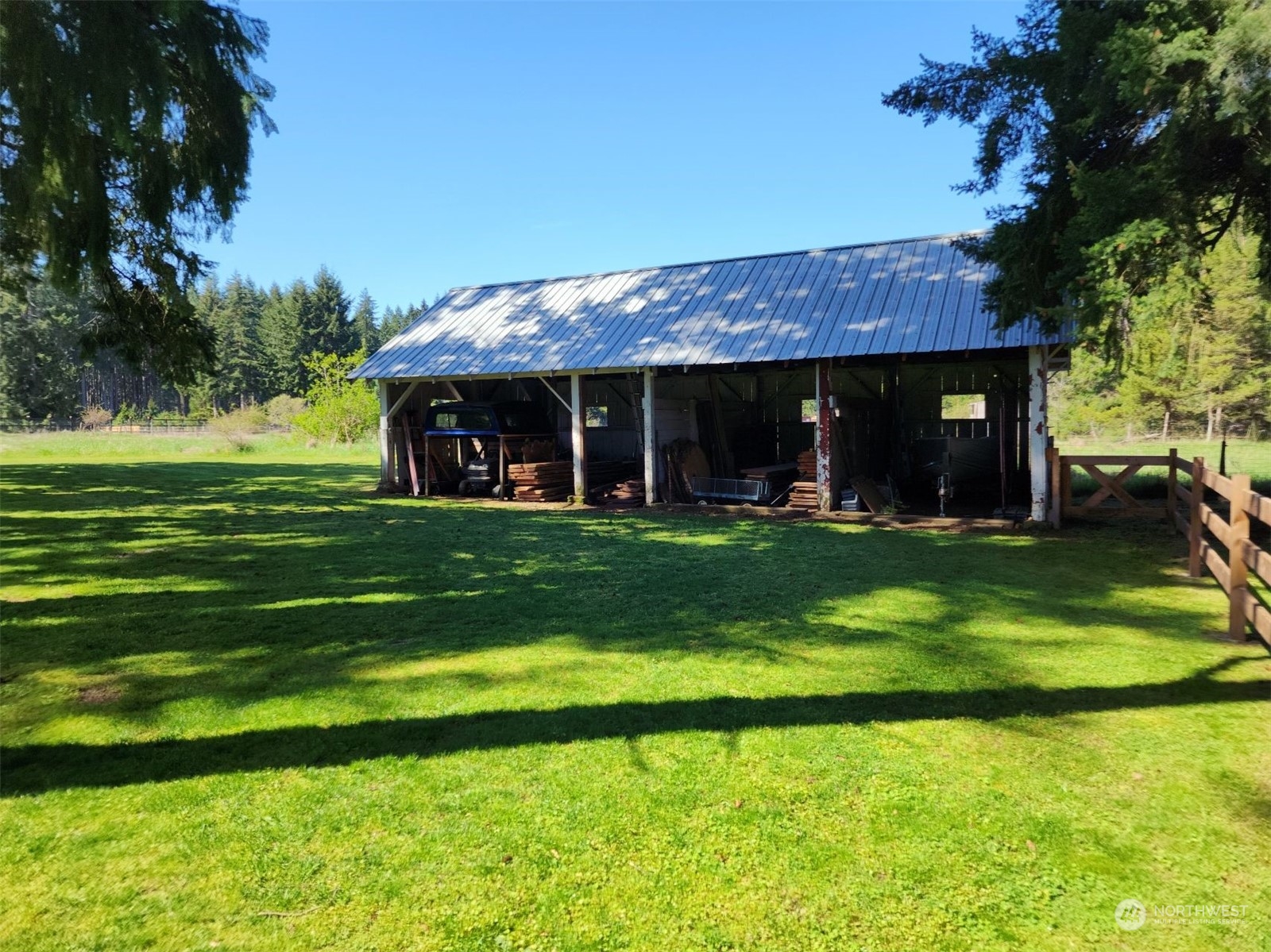 19312 Patterson Road East Orting, WA 98360 - Photo 33 of 39 a view of a big house with a big yard and potted plants