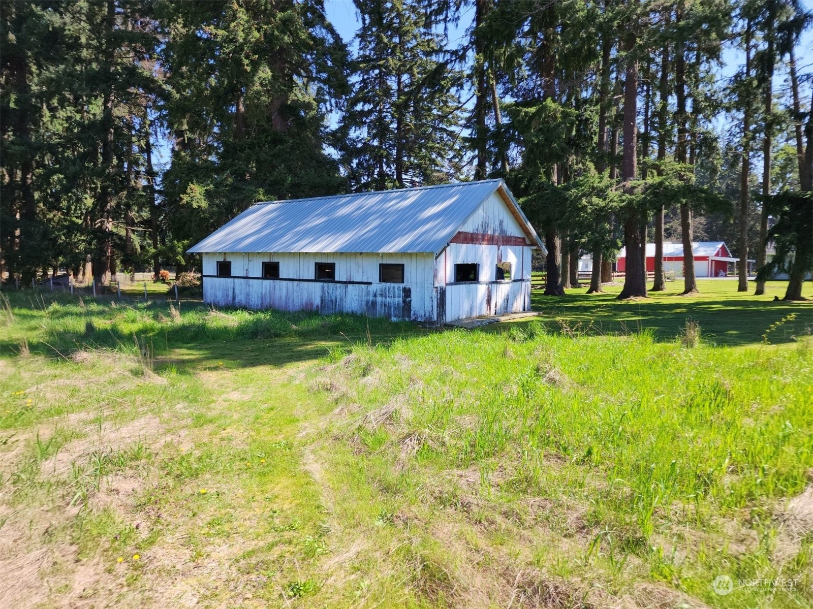 19312 Patterson Road East Orting, WA 98360 - Photo 35 of 39 a front view of a house with a garden and trees