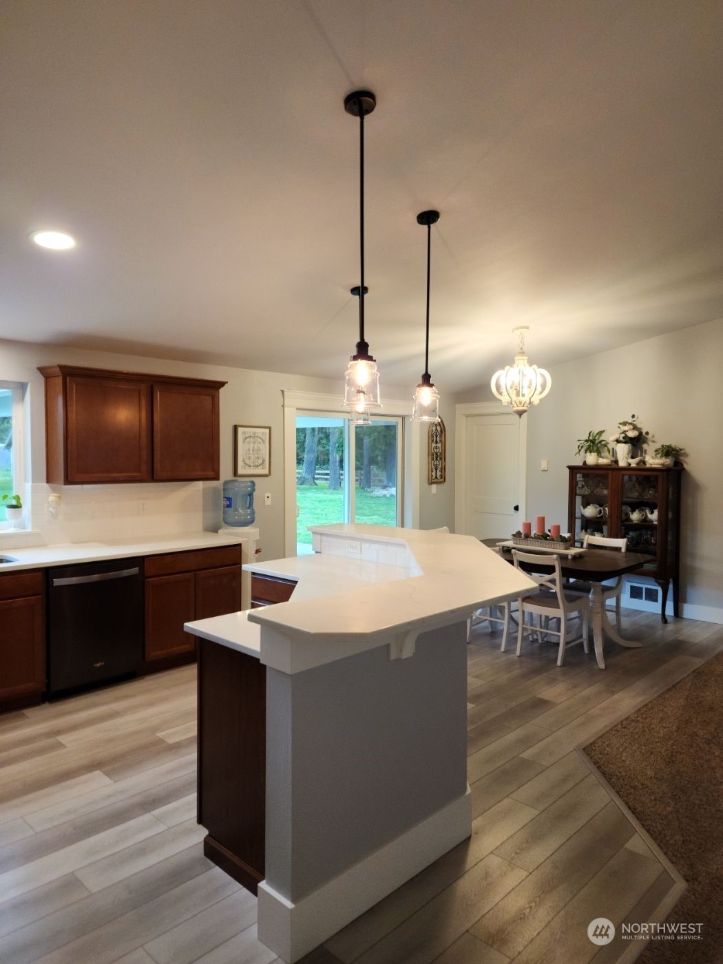 19312 Patterson Road East Orting, WA 98360 - Photo 9 of 39 a large kitchen with kitchen island a sink table and chairs